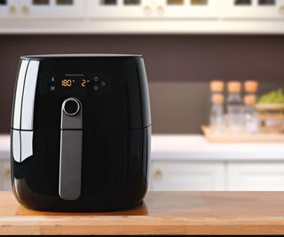 A back air fryer turned on to 180 degrees in a kitchen
