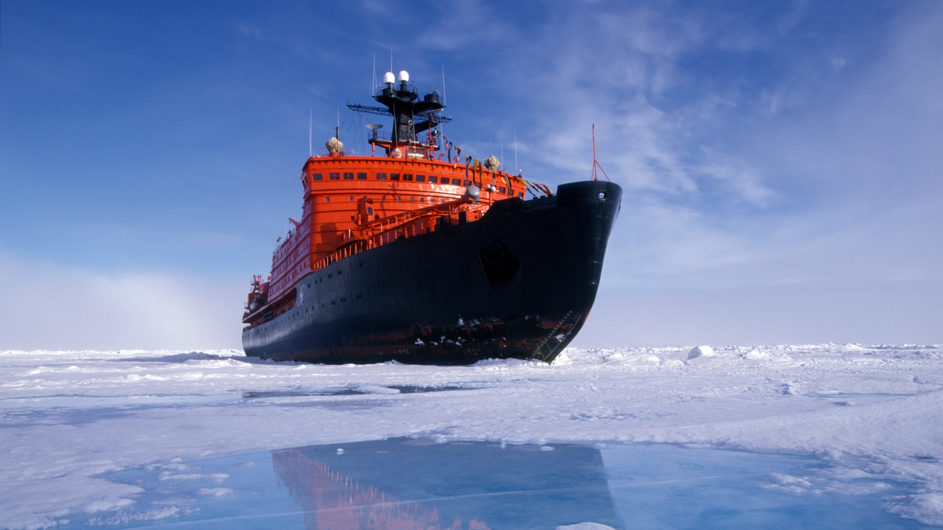 an icebreaker traversing a sea covered with ice