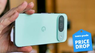 Pixel 9 held in the hand with price drop badge nearby.