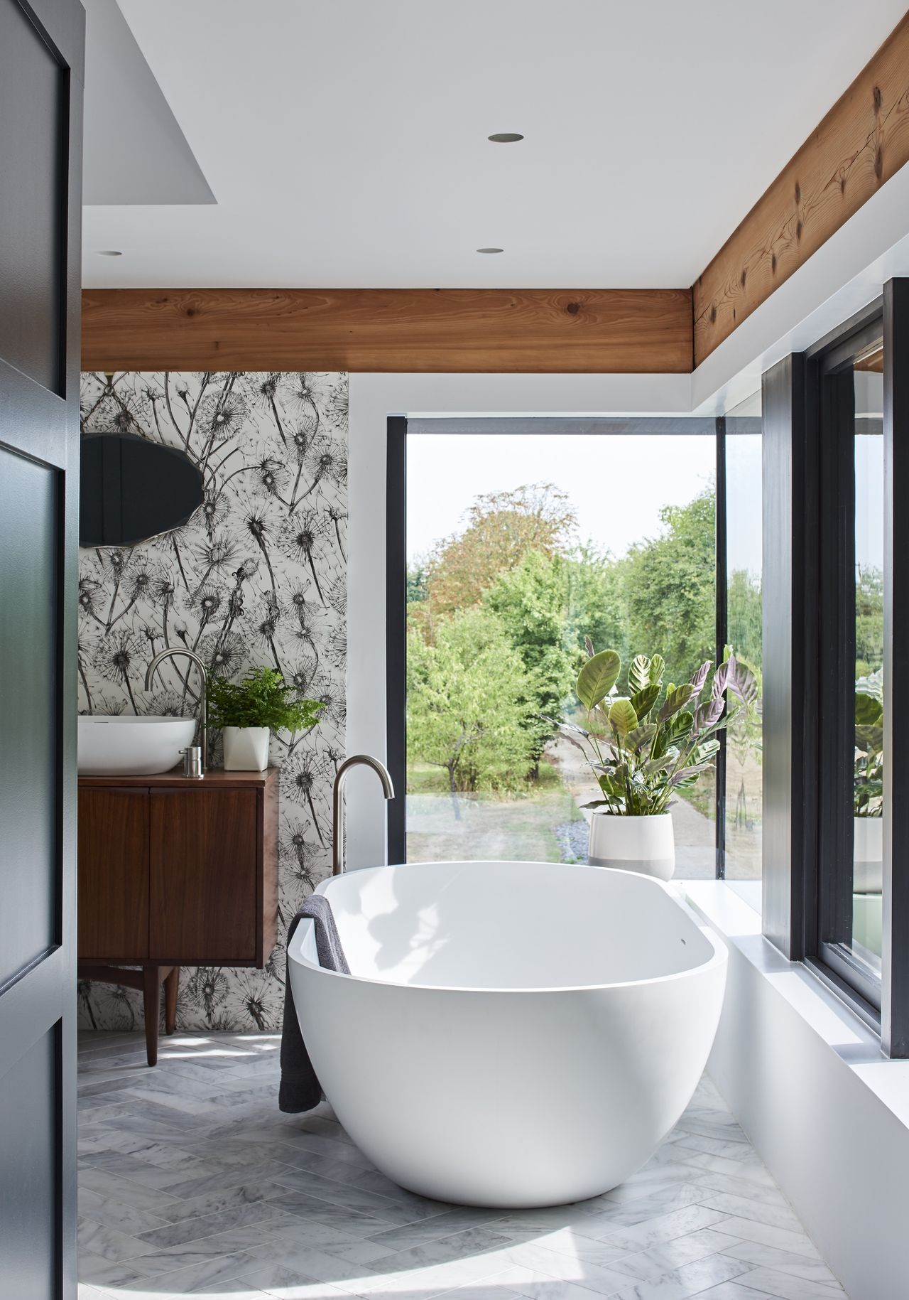 bathroom with view out of corner windows