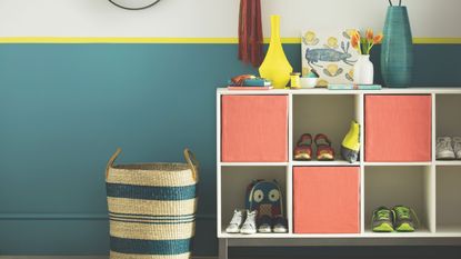 Hallway with floor to ceiling wall panelling painted light green