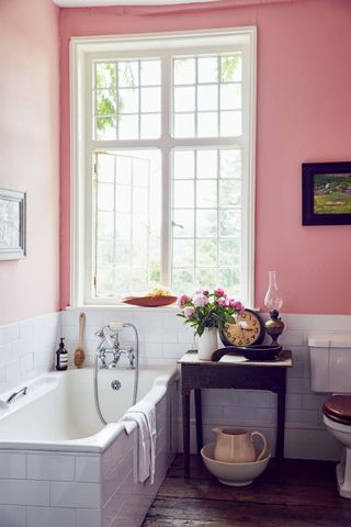 bathroom with traditional fittings and pink walls