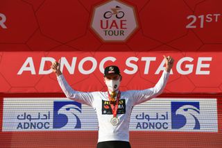 ABU DHABI UNITED ARAB EMIRATES FEBRUARY 21 Podium David Dekker of The Netherlands and Team JumboVisma Best White Young Rider Jersey Celebration during the 3rd UAE Tour 2021 Stage 1 a 176km stage from Al Dhafra Castle to Al Mirfa Trophy Mask Covid Safety Measures UAETour on February 21 2021 in Abu Dhabi United Arab Emirates Photo by Tim de WaeleGetty Images