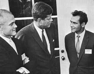 Second cosmonaut German Titov (right) appears with NASA astronaut John Glenn and President John Kennedy at the White House in 1962. Titov was in Washington to give his account of the Vostok 2 spaceflight to the Committee on Space Research (COSPAR). The tw