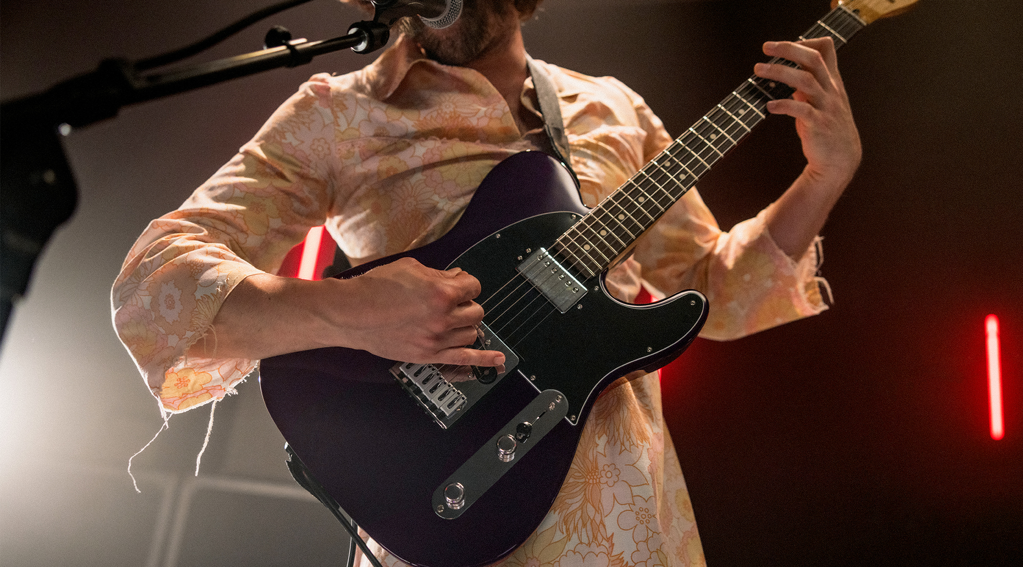 A photo of Mark Bowen, guitarist with the band Idles, playing a Fender Player II Modified Telecaster