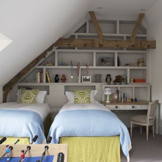 kids room with white shelves and beds