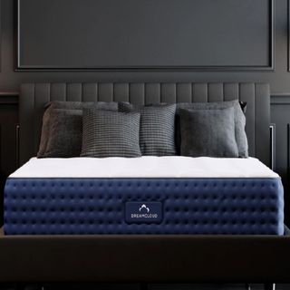 A DreamCloud mattress on a bed with pillows