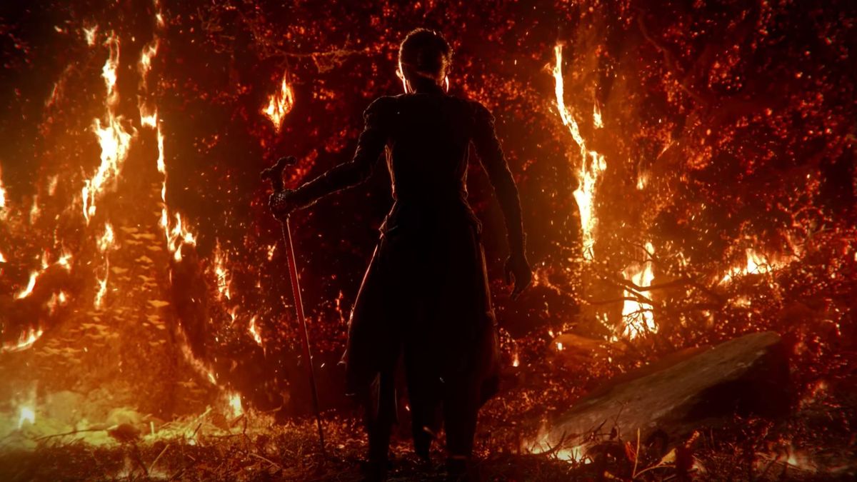 Path of Exile 2 screenshot from the opening cinematic trailer, showing someone stood surrounded by flames.