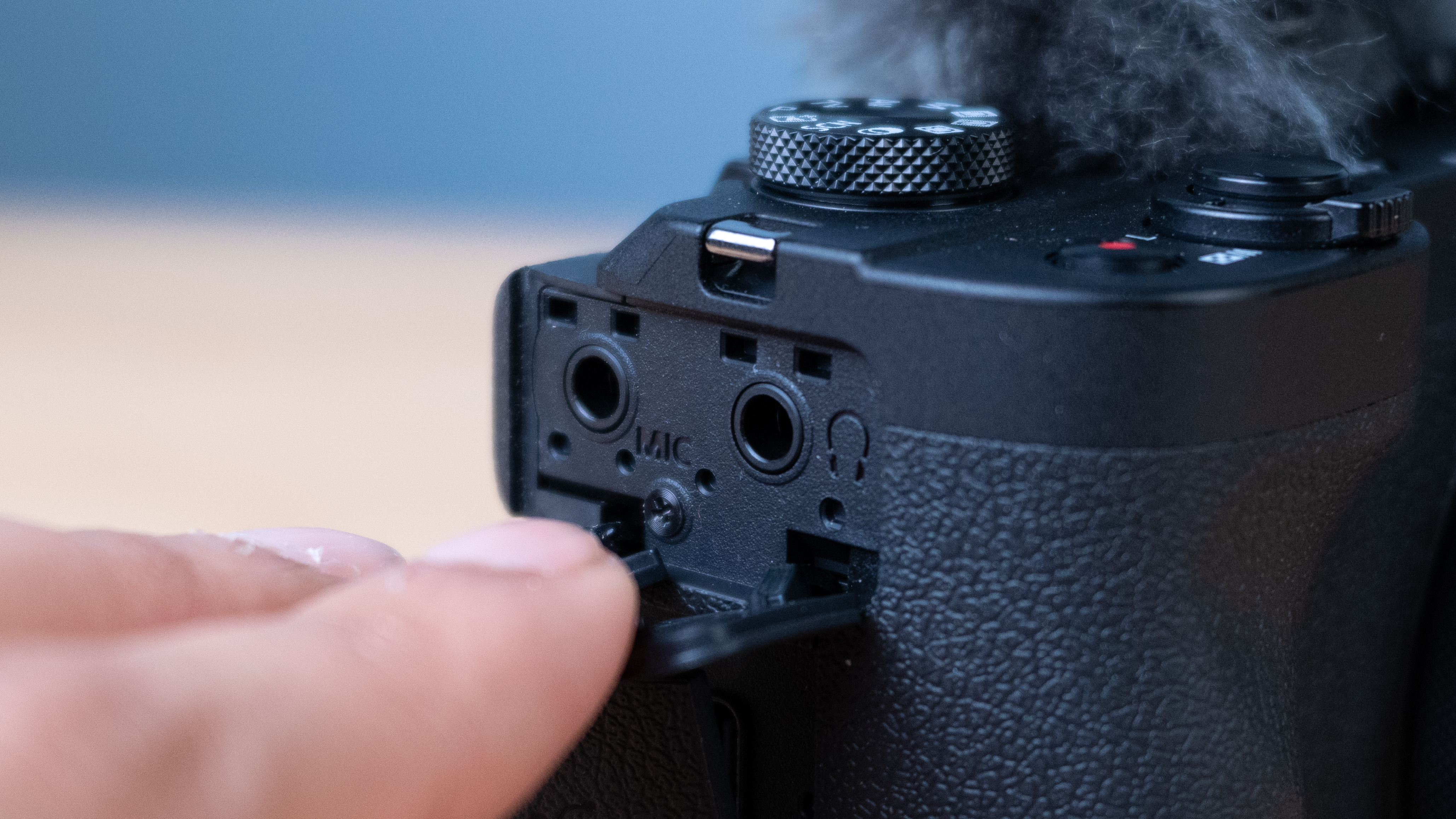 A black Canon PowerShot V1 compact vlogging camera