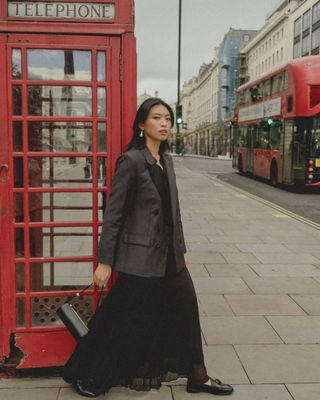 fashion influencer Michelle Lin carrying a J.Crew barrel bag in London for an campaign with the brand