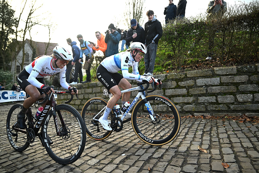 NIVONE, BELGIUM - FEBRUARY 28: (L-R) Kasia Niewiadoma of Poland and Team Canyon-SRAM and Demi Vollering of Netherlands and Team FDJ United - SUEZ compete in the breakaway passing through the Muur - Kapelmuur cobblestones sector during the 21st Omloop Het Nieuwsblad 2026, Women&amp;amp;apos;s Elite a 137.2km one day race from Ghent to Ninove / #UCIWWT / on February 28, 2026 in Ninove, Belgium. (Photo by Luc Claessen/Getty Images)