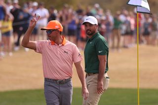 Fowler waves to the crowd after his hole-in-one