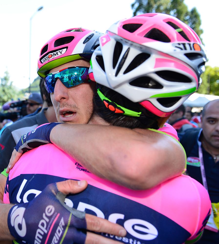 Stage 17 winner Sacha Modolo hugs a teammate.