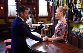 Jack Branning talks to Linda Carter who is behind the bar in the Queen Vic pub