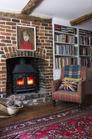 Living room with armchair and wood stove