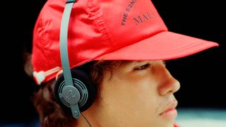 Gadhouse Wesley worn by a boy in profile, over a red baseball cap