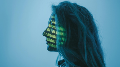 A woman with number code on her face while looking afar.