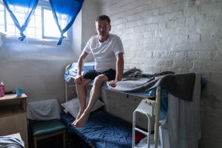 Sid Owen on a prison bunk bed in his cell.
