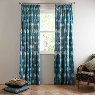 curtains on window with white wall and cushions