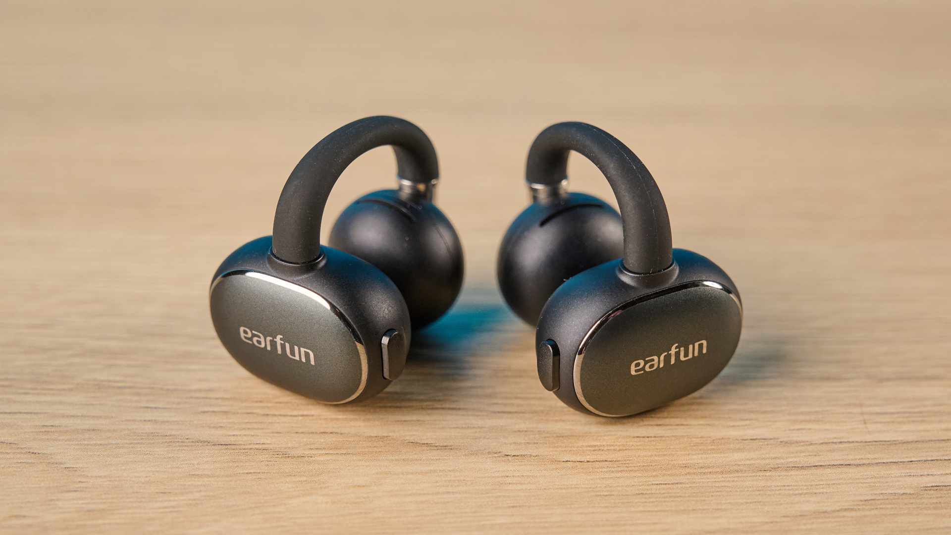 EarFun Clip 2 in black on wooden table