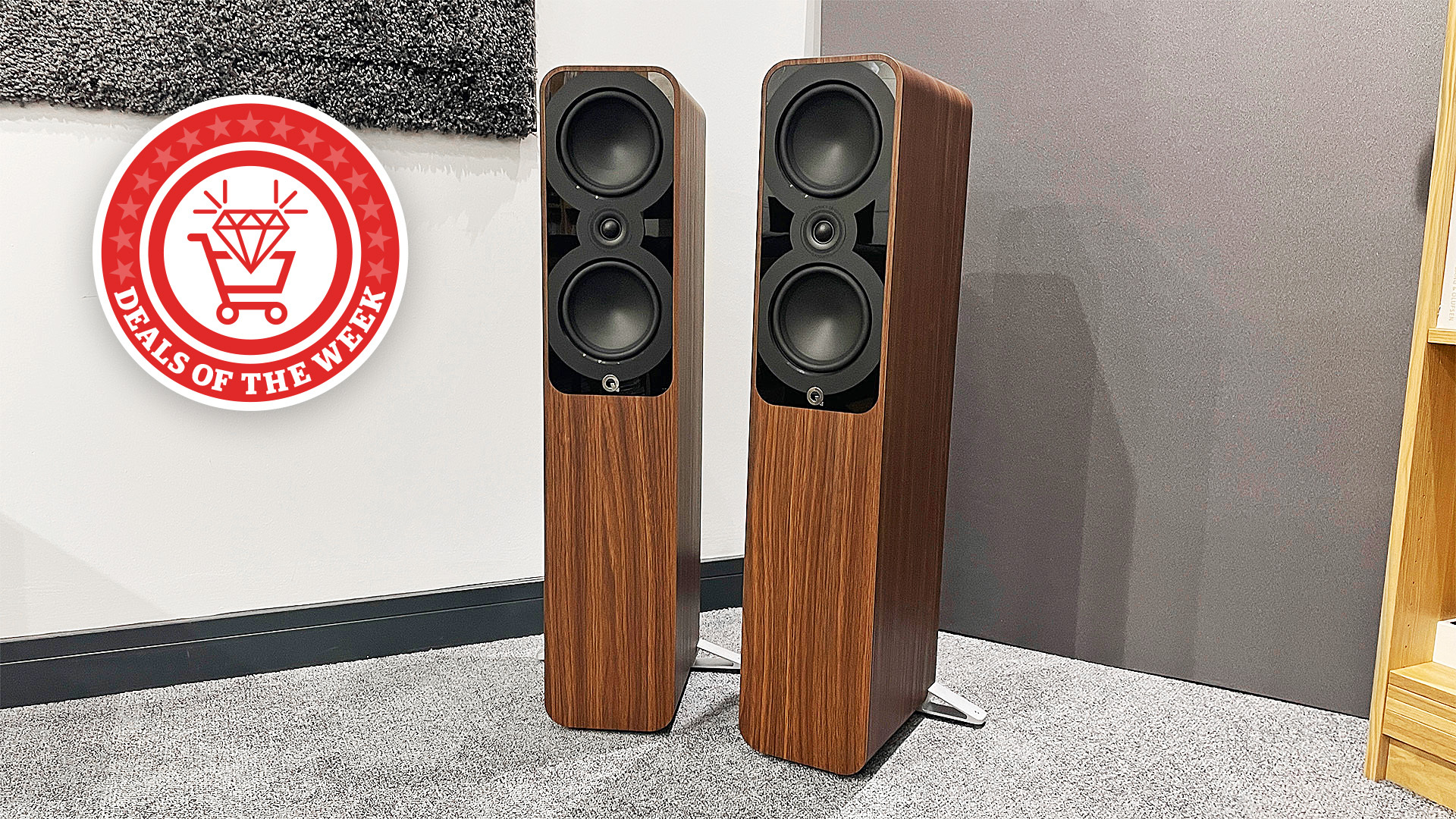 The Q Acoustics 5050 in our test room, with the Deals of the Week logo overlaid