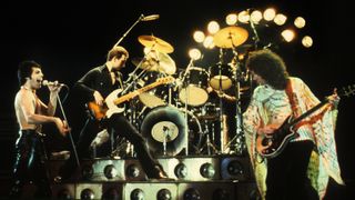 Freddie Mercury, John Deacon and Brian May of Queen live on stage
