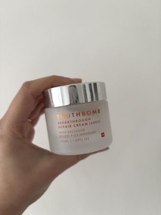 Mica Ricketts holding Beauty Pie Youthbomb Breakthrough Repair Cream