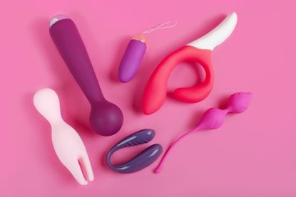 Silicone sex toys on a pink background. Erotic toy for fun. Sex gadget and masturbation device.