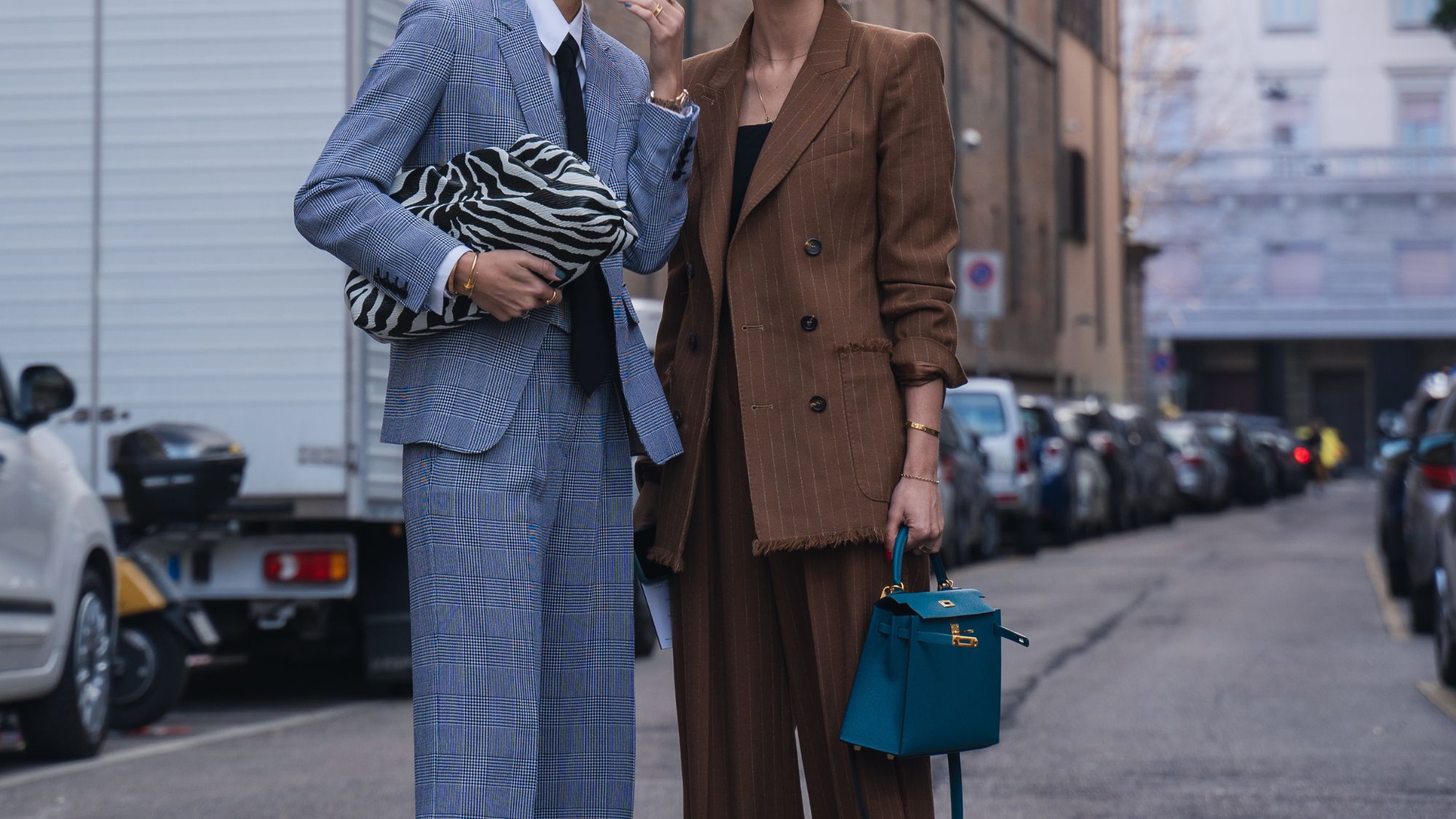 Milan, Italy - 20 February 2020: Stylish persons are posing for photographers before Max Mara fashion show on Milan Woman's Fashion Week F/W2020-2021, street style - stock photo