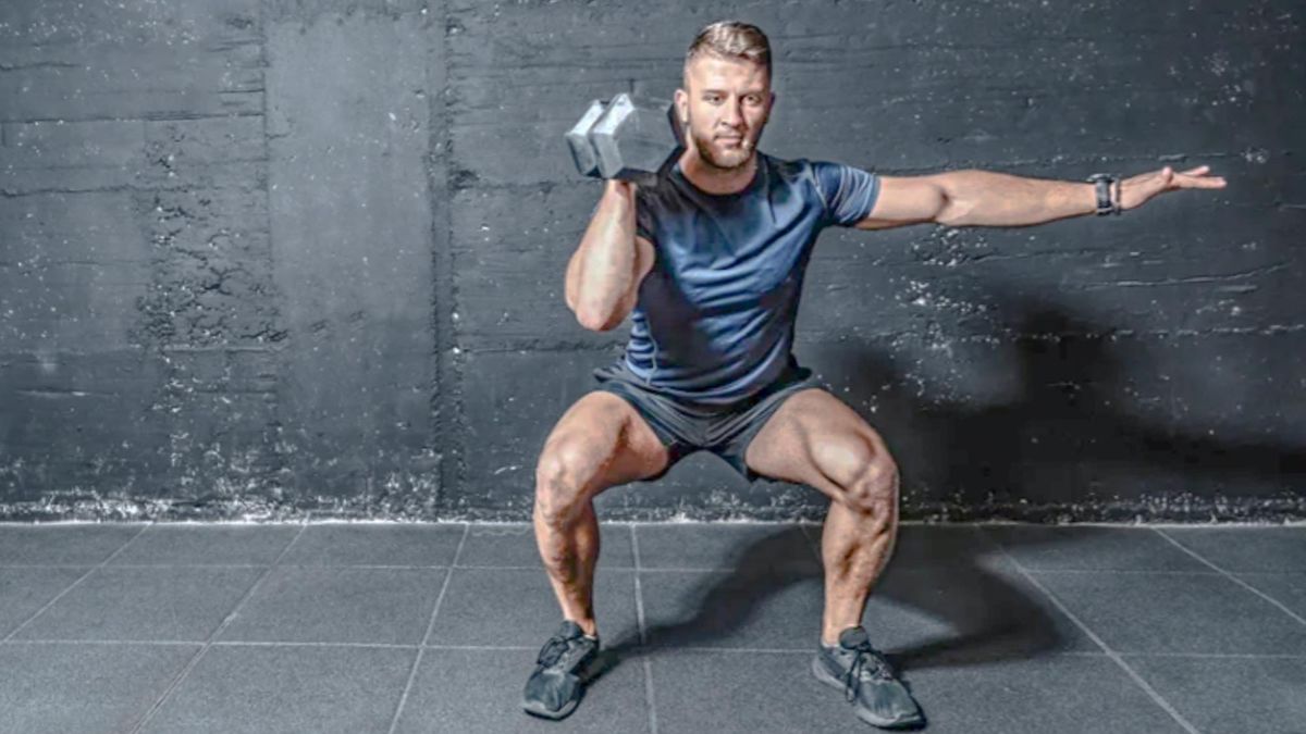 Man performing an overhead dumbbell press