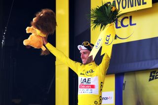 BAYONNE FRANCE JULY 03 Adam Yates of United Kingdom and UAE Team Emirates celebrates at podium as Yellow leader jersey winner during the stage three of the 110th Tour de France 2023 a 1935km stage from AmorebietaEtxano to Bayonne UCIWT on July 03 2023 in Bayonne France Photo by David RamosGetty Images