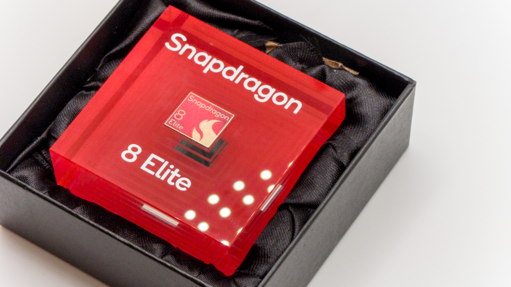 A Qualcomm Snapdragon 8 Elite placard at a press event