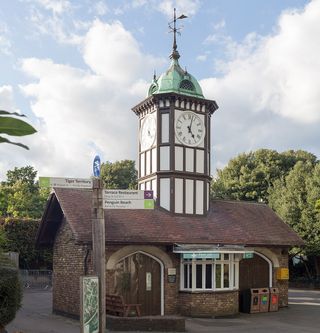 the clock tower at london zoo see against blue skies with slight cloud in all its preserved Victorian glory