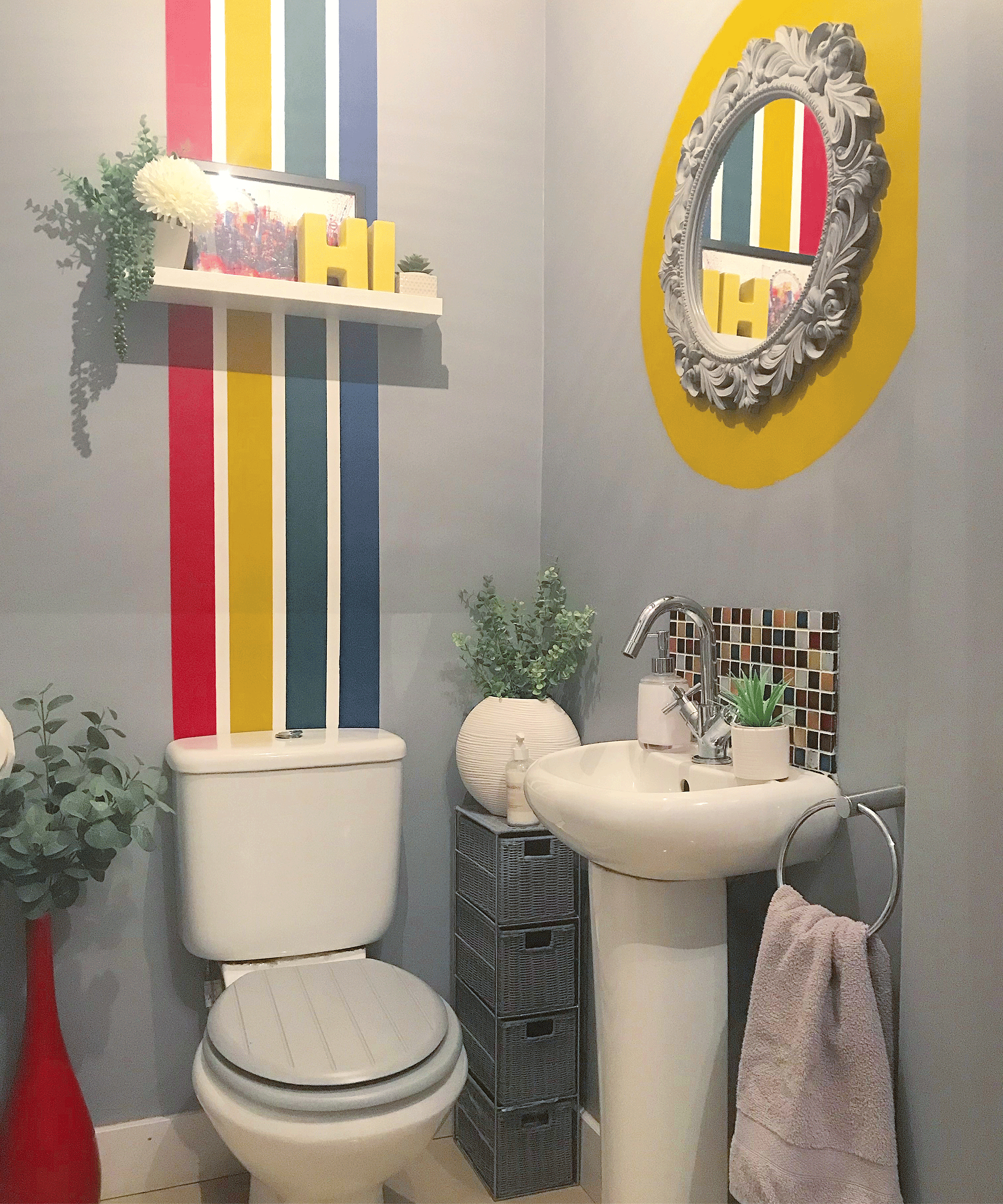 Grey bathroom with rainbow wall decor by Hilary Crawford (_hilarycrawford)