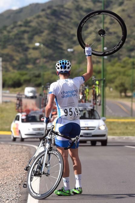Andrea Peron waits for a new tire during stage 2.