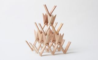 Wooden building blocks creation - a series of block interlocked ino a striking pyramid design
