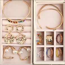 Stock photo of jewelry box with earrings, bracelets, rings, necklaces