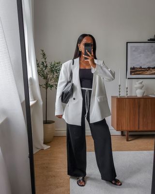 @femmeblk wearing a tailored Zara set