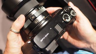 Fujifilm GFX 50R held in hands