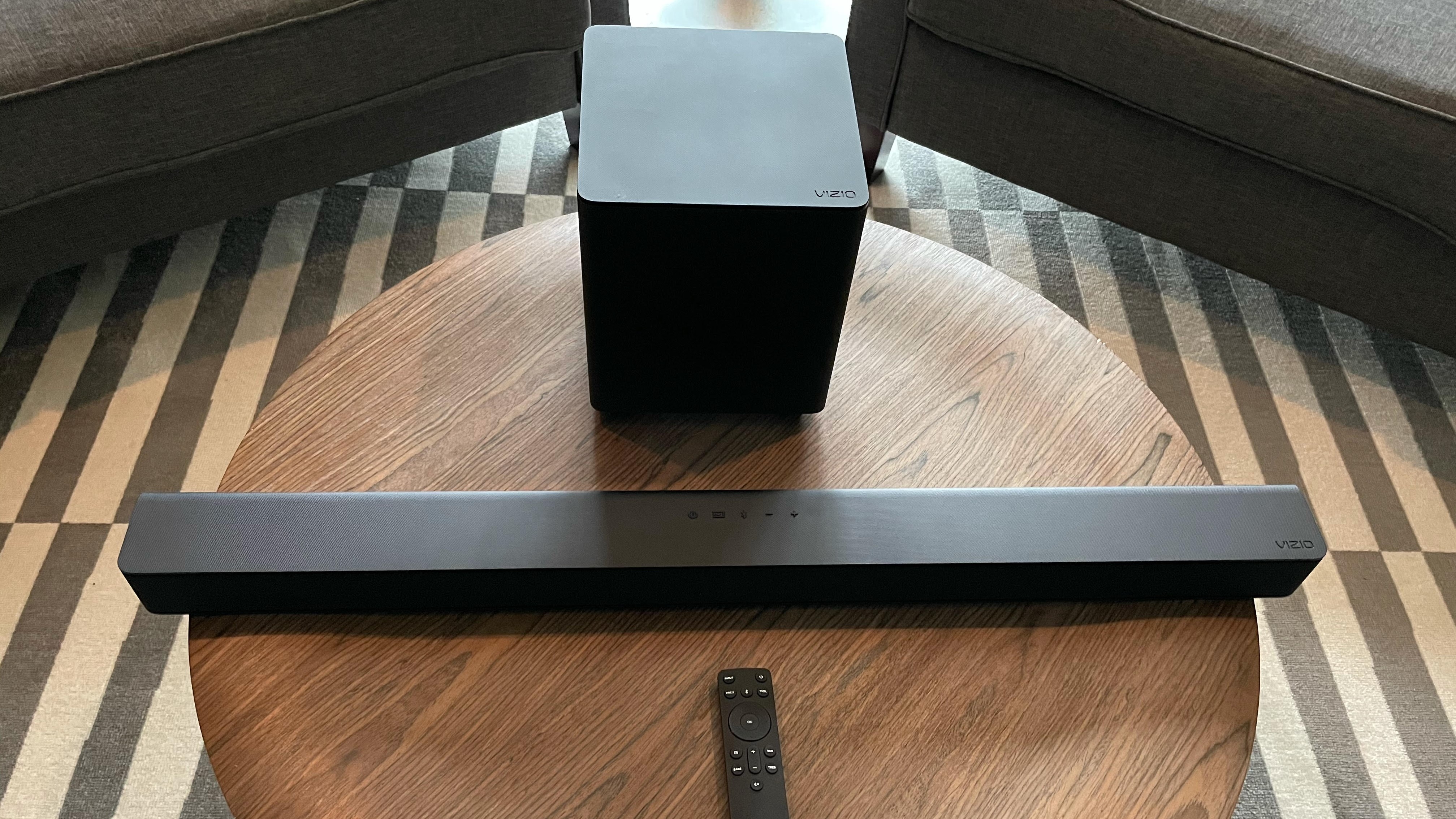 Vizio V-Series 2.1 Home Theater Soundbar V21-H8 is placed on a wooden table