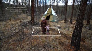 Best design ideas: Mongolian mother and child in front of tent