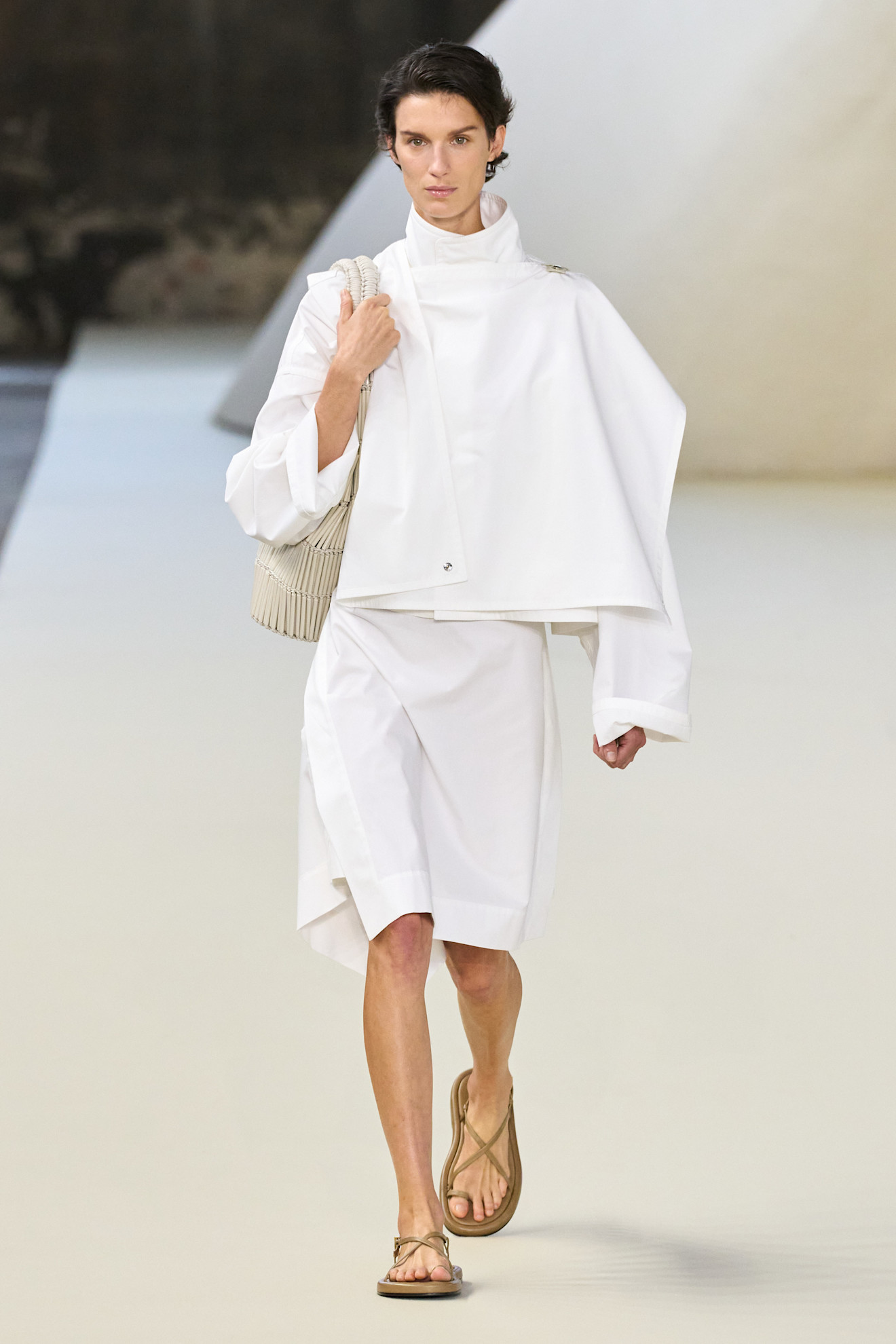 Brown toe ring sandals worn by a model on Tod's Spring 2025 runway