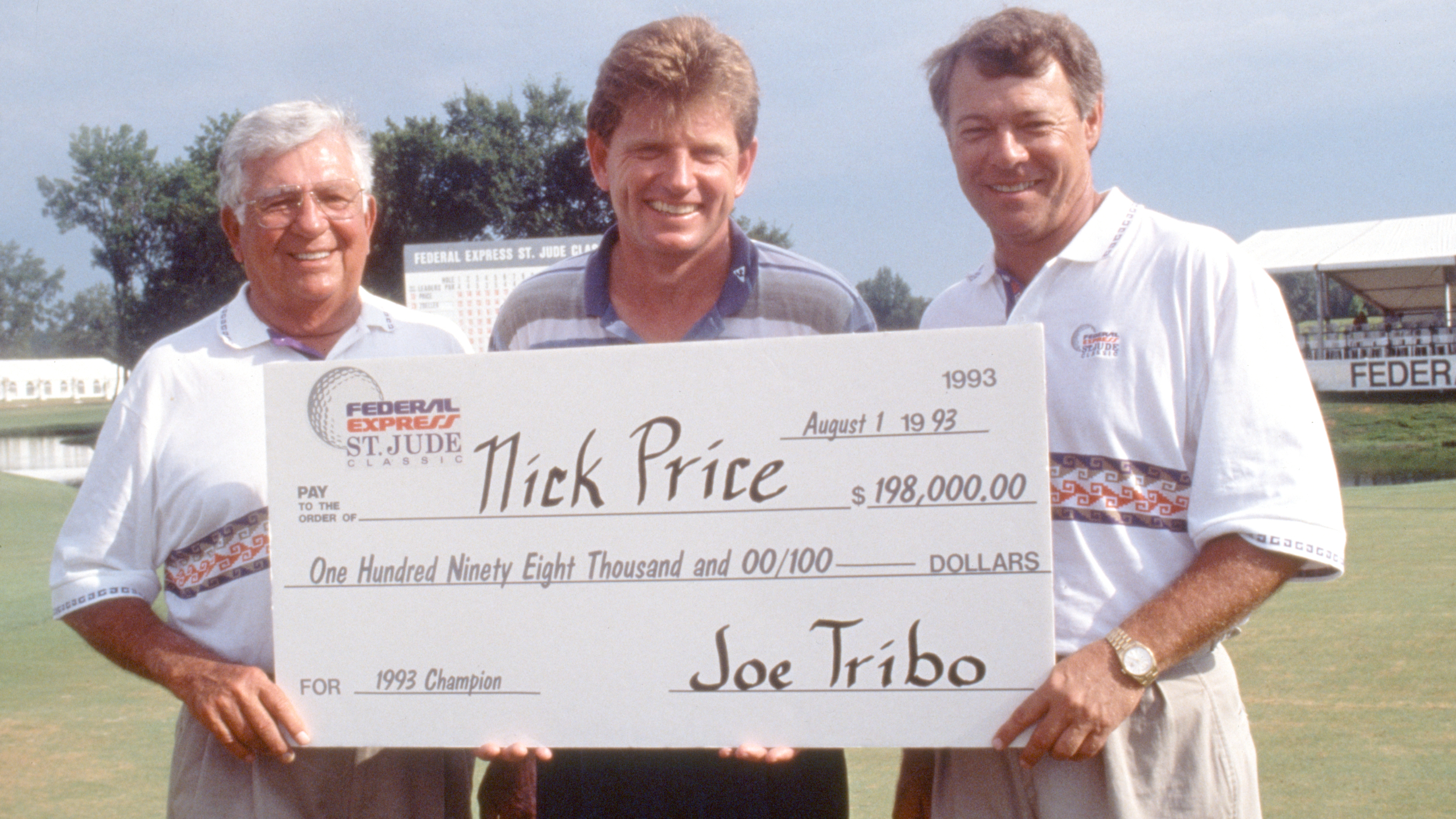 Nick Price is given a cheque for winning the Fereral Express St. Jude Classic