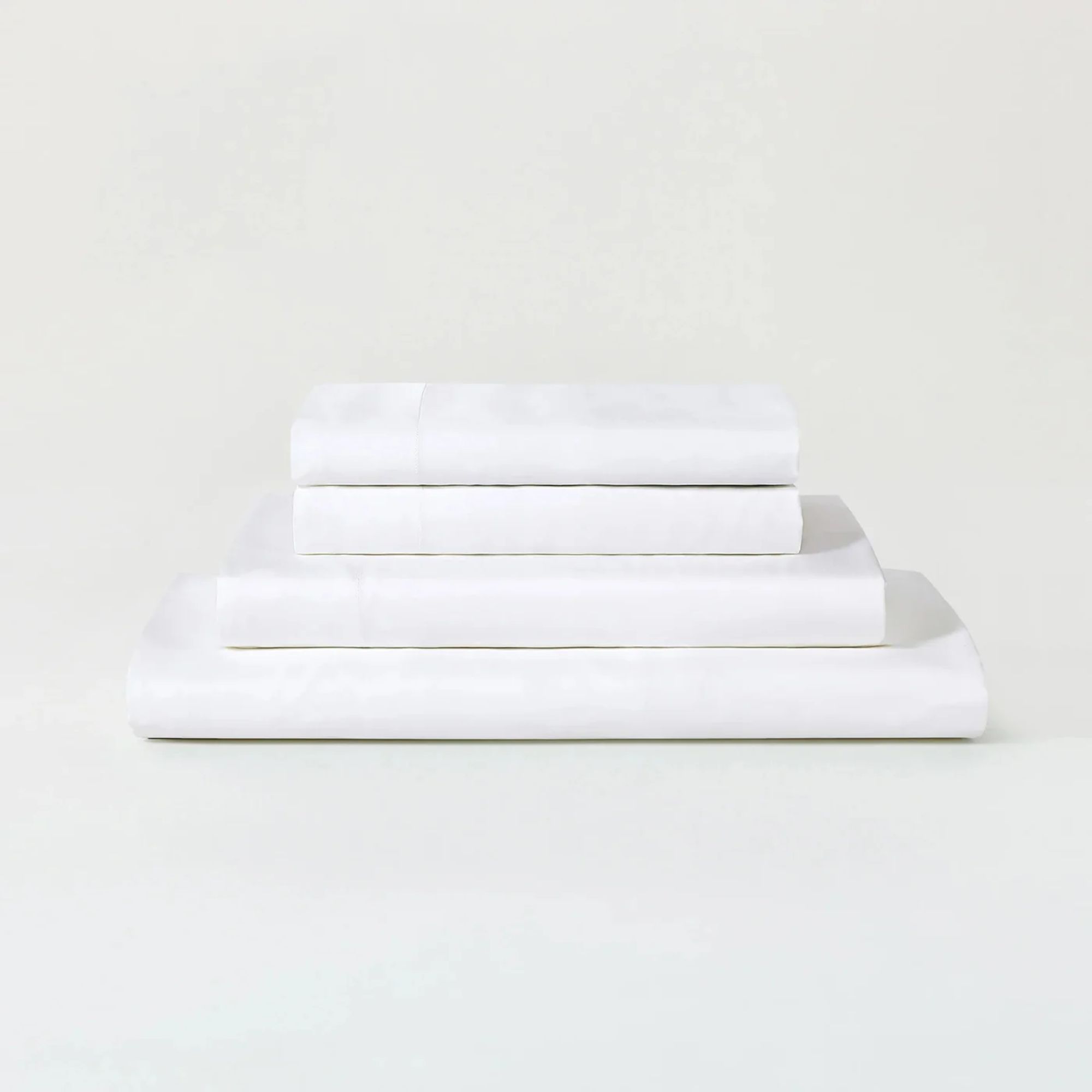 A white Sijo AiryWeight Eucalyptus Sheet Set folded and stacked