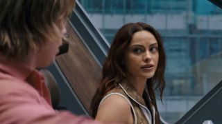 Camila Mendes as Teela, looking back at Adam in Masters of the Universe