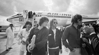 The Doors strep off their plane at Heathrow Airport