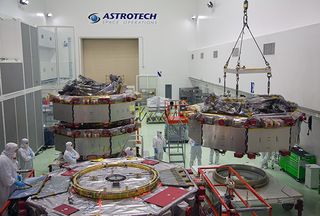 All four MMS satellites, shown here in a clean room at Astrotech. The four satellites will fly in a pyramid formation to give scientists a three-dimensional view of magnetic reconnection — the driver of solar weather.