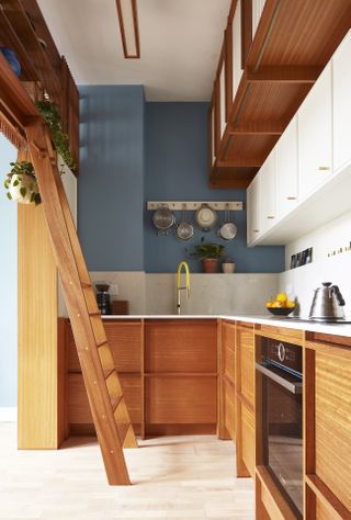 small wooden kitchen with white worktop