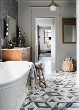 Farmhouse bathroom with grey and white mosaic-tiled floor