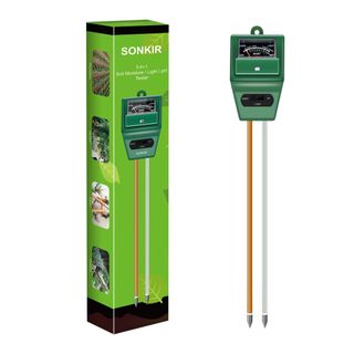 Green Sonkir Soil pH Meter with gold and silver prongs on the left with the green box on the right